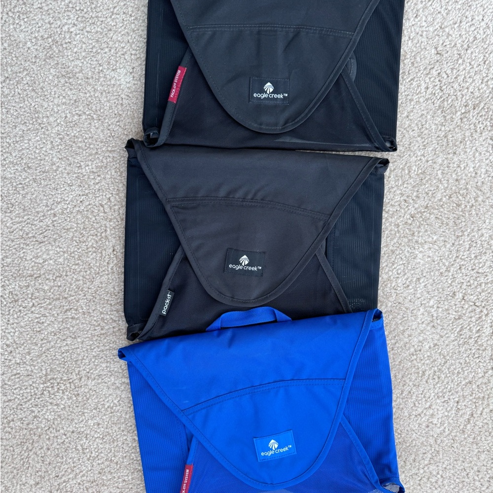 Three medium Eagle Creek Pack It bags